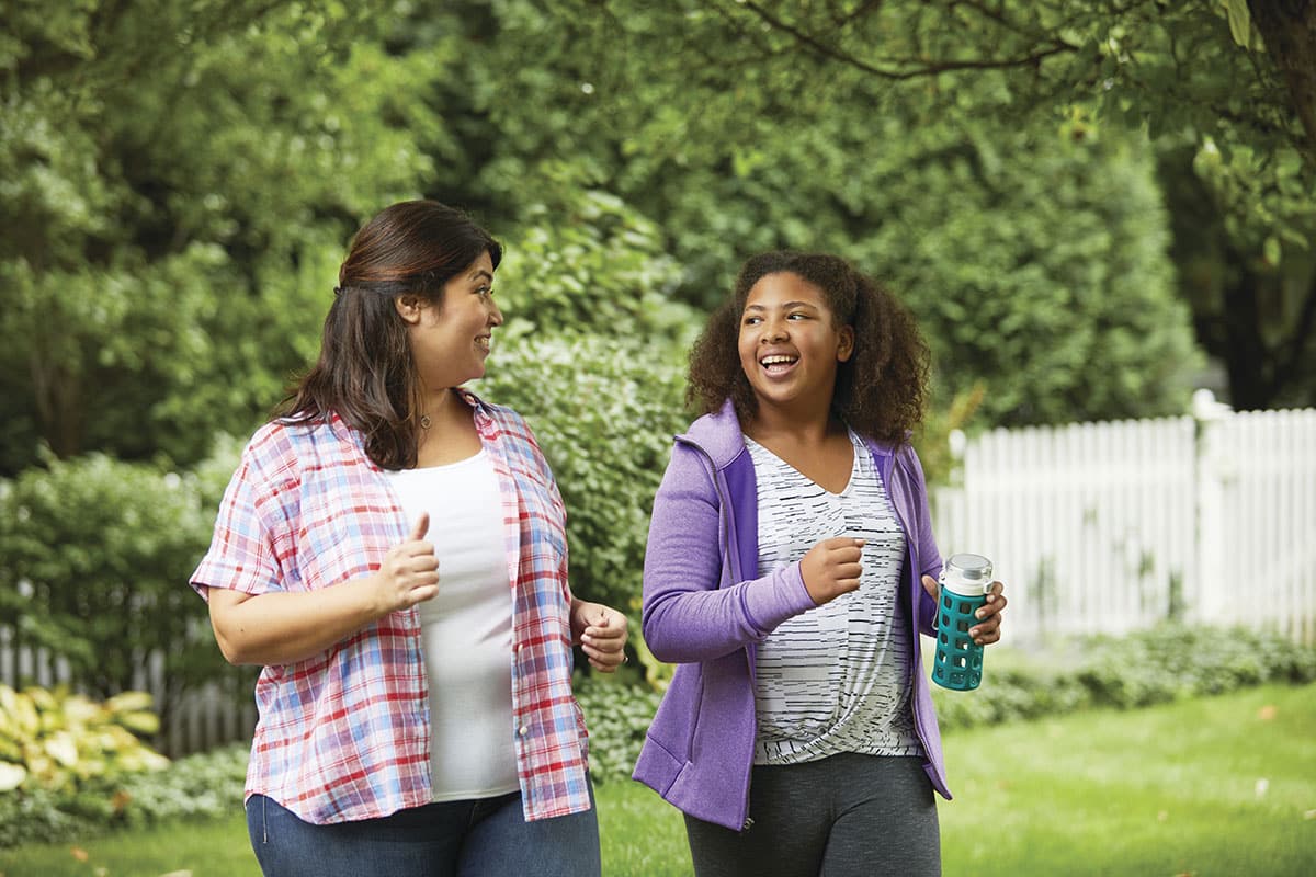 a woman and a girl running