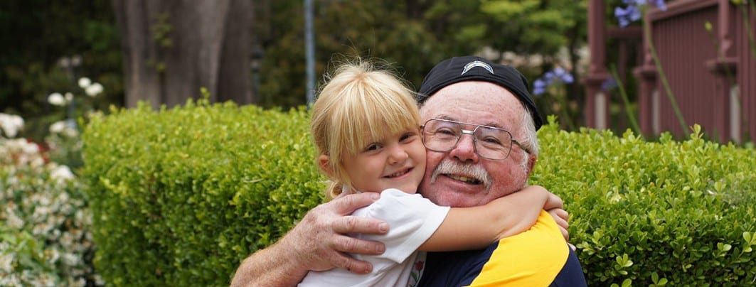 a man and a child hugging