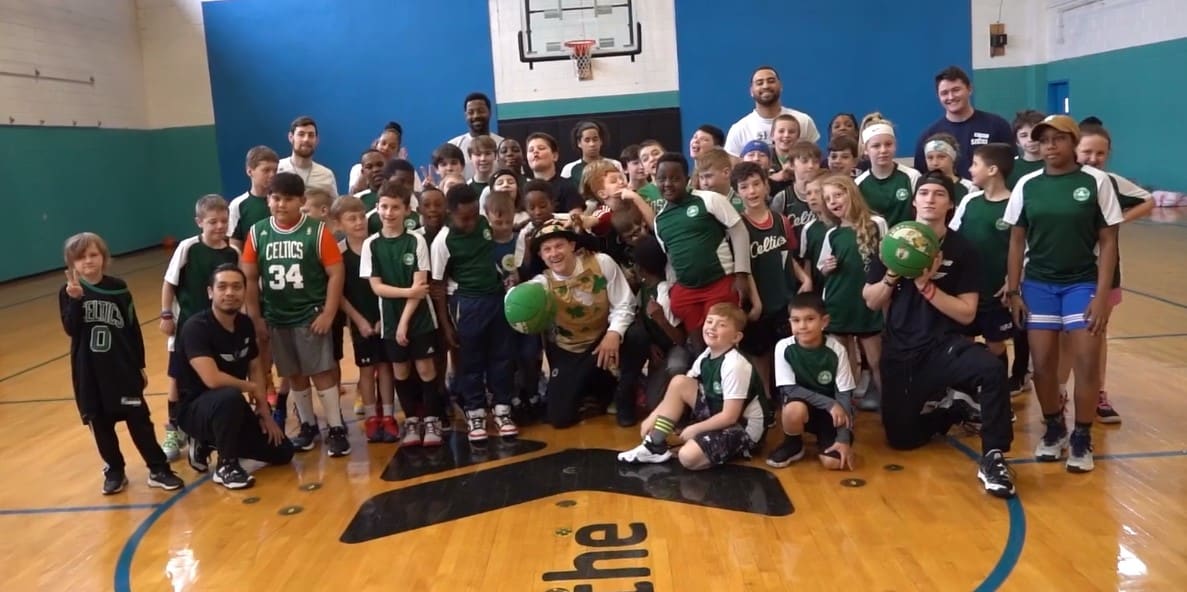 a group of kids posing for a photo | basketball