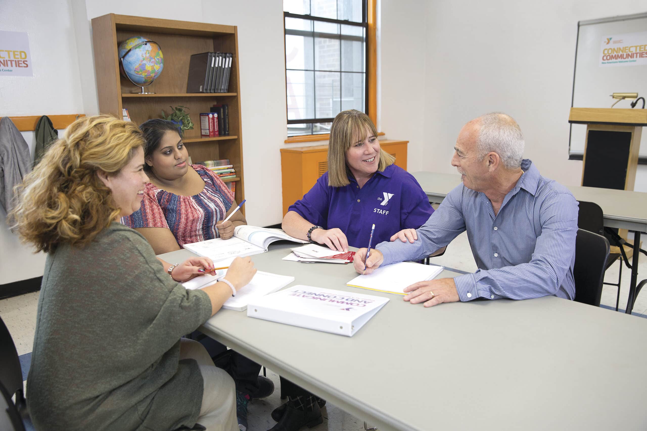 a group of people sitting around a table
