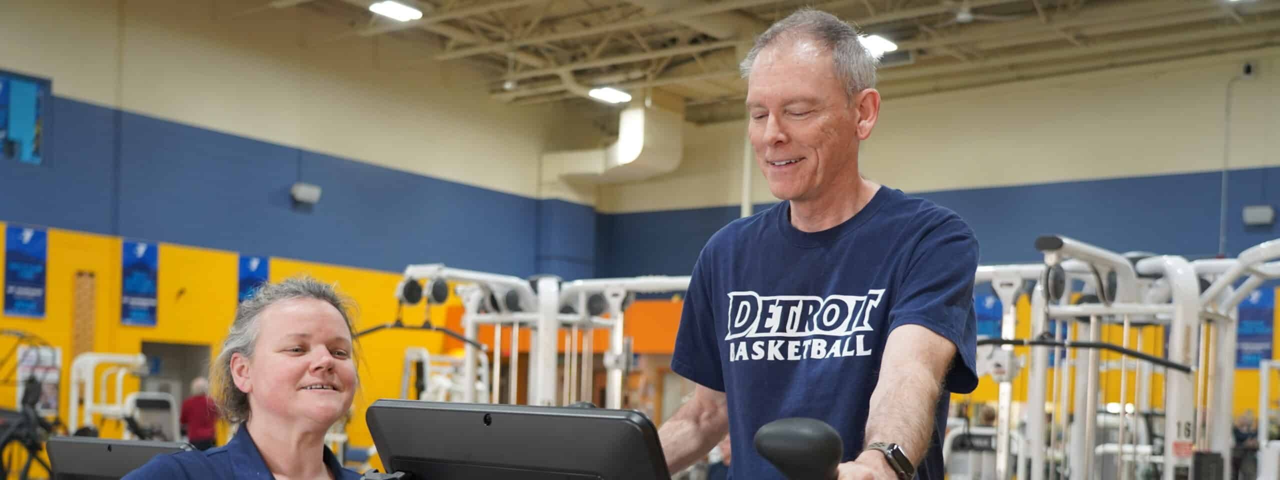a man and woman in a gym