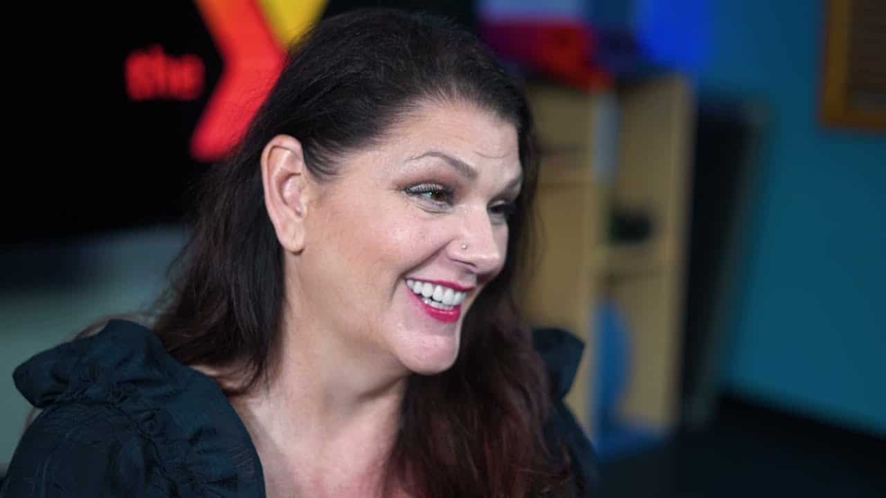 a woman smiling at the camera