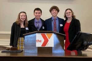 a group of people standing at a podium