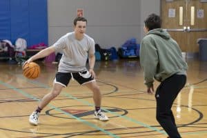Teenager playing basketball at The Granite YMCA